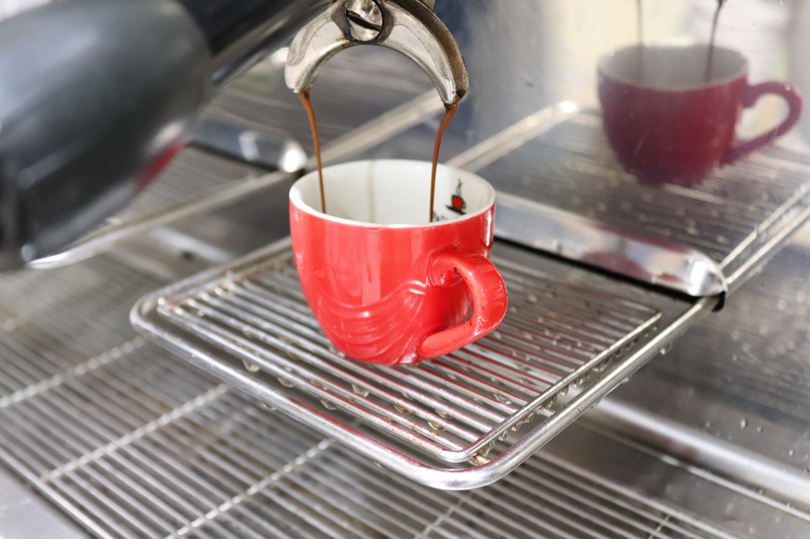 Espresso pulled into a red cup