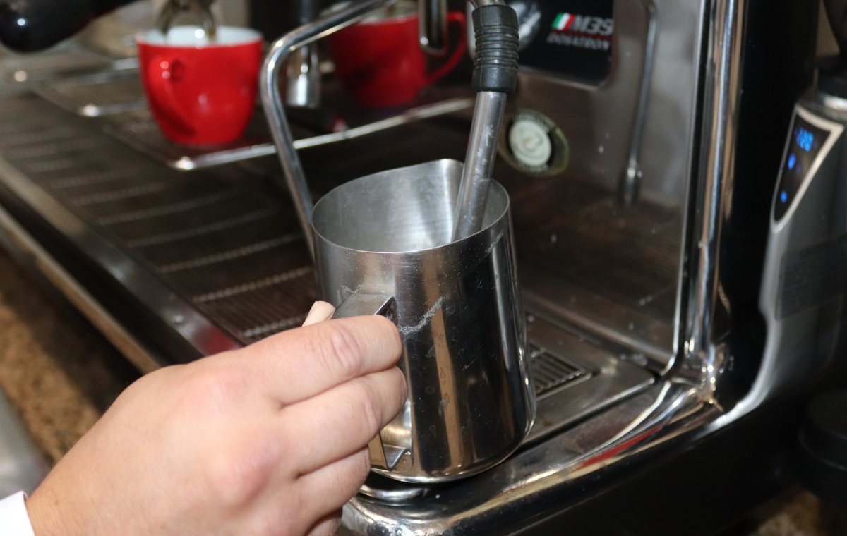 Steaming milk on a commercial espresso machine
